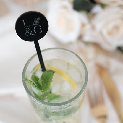 Initial drink stirrers
